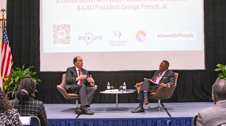 World Bank Group President David Malpass, left, participates in a fireside chat with Clark Atlanta University President George French, Jr., right, at the Robert W. Woodruff Library at Clark Atlanta on Friday, May 5, 2023.  (Jenni Girtman for The Atlanta Journal-Constitution)