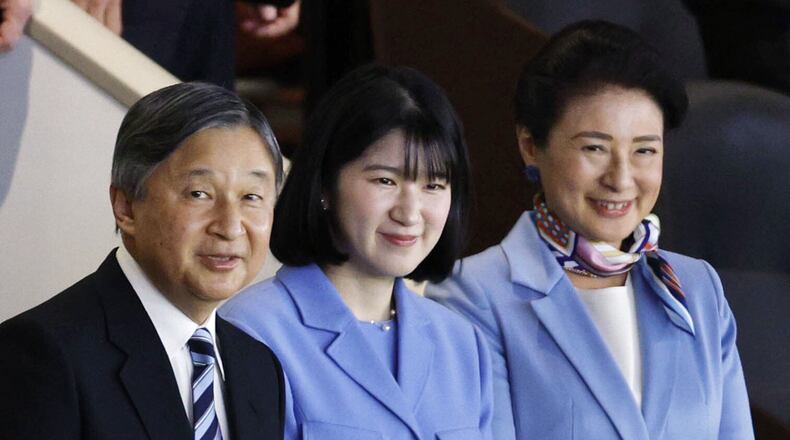 Japan's Emperor Naruhito, Empress Masako, right, and their daughter Princess Aiko watche a World Baseball Classic game between Japan and Australia, in Tokyo Sunday, March 8, 2026. (Suo Gakekuma/Kyodo News via AP)