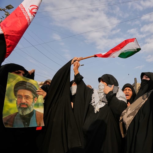 Iraqi Muslim women hold portraits of Iran's late Supreme Leader Ayatollah Ali Khamenei and his son Ayatollah Mojtaba Khamenei, during a protest against U.S. and Israeli attacks on multiple cities across Iran, in Baghdad, Iraq, Saturday, April 25, 2026. (AP Photo/Hadi Mizban)