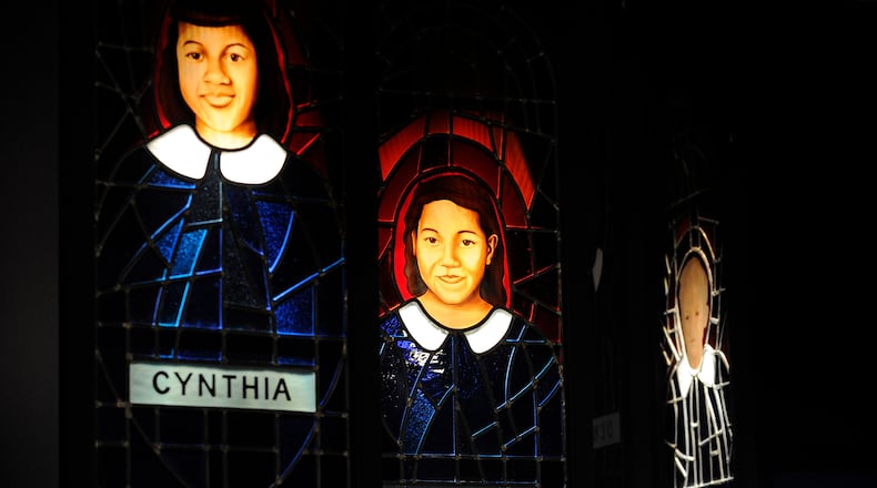 A stained-glass memorial at the National Center for Civil and Human Rights to the four young girls killed in Birmingham David Tulis / AJC Special