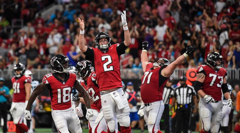 Atlanta Falcons quarterback Matt Ryan (2) reacts after scoring a touchdown against the Carolina Panthers during the second half at Mercedes-Benz Stadium.