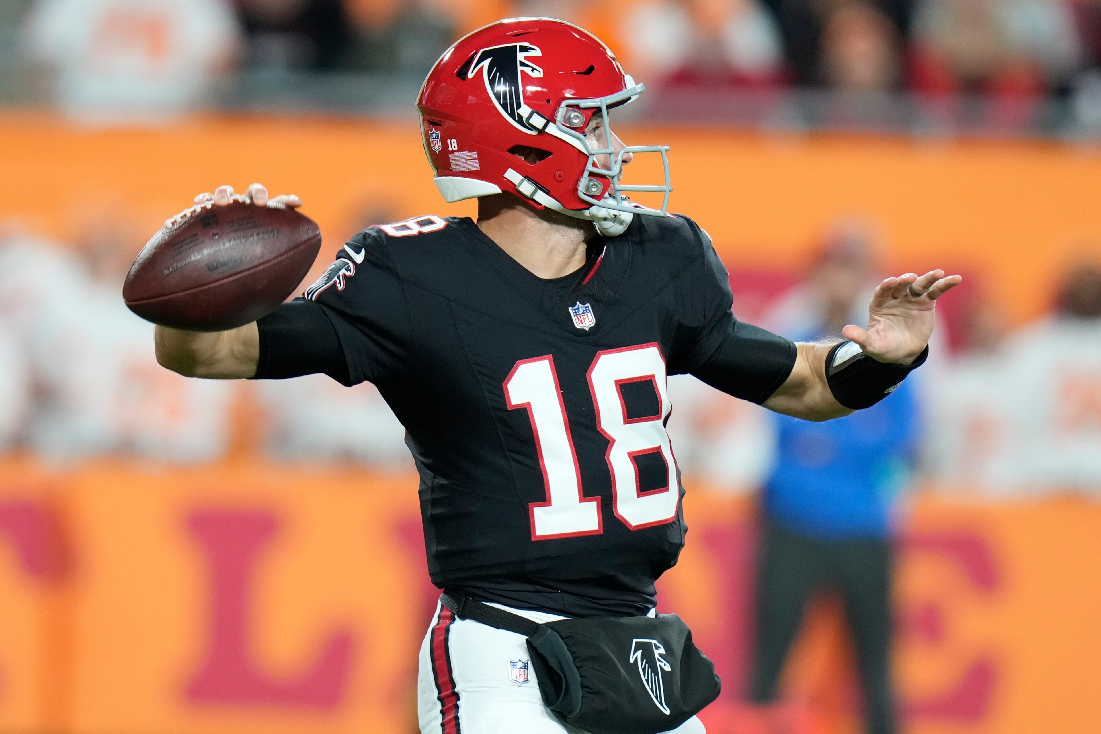 Atlanta Falcons quarterback Kirk Cousins (18) passes in the pocket against the Tampa Bay Buccaneers during the first half of an NFL football game, Thursday, Dec. 11, 2025, in Tampa, Fla. (AP Photo/Chris O'Meara)