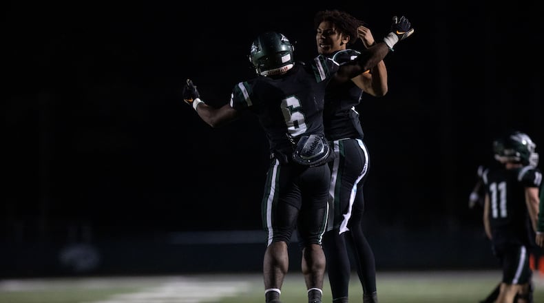 Collins Hill's Spenser Anderson (6) and Ethan Davis (9) celebrate during a GHSA high school football game between the Collins Hill Eagles and the Grayson Rams at Collins Hill High in Suwanee, GA., on Friday, December 3, 2021. (Photo/ Jenn Finch)