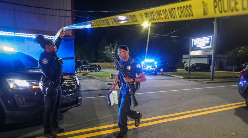 Atlanta police investigators process a deadly shooting scene in October 2020. (John Spink / John.Spink@ajc.com)