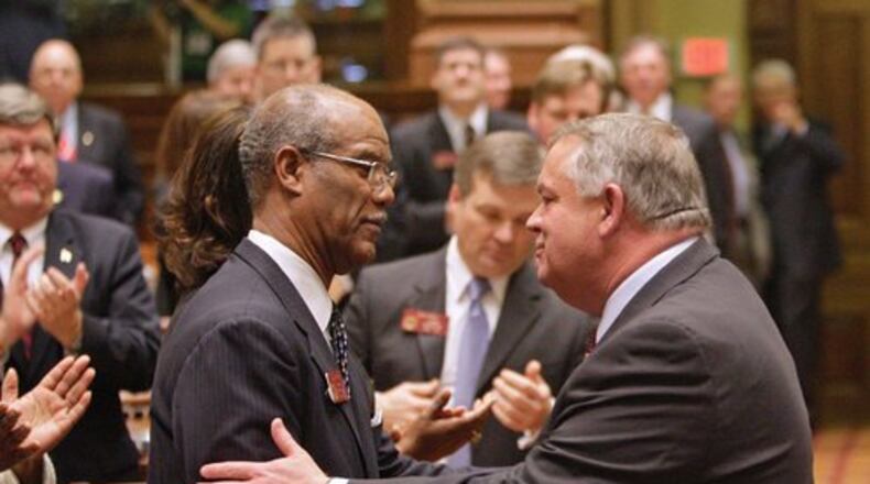 Newly elected speaker David Ralston (right), a Republican from north Georgia, and Rep. Calvin Smyre, the Democratic nominee for the post, exchange greetings during Ralston's official escort into the chamber.