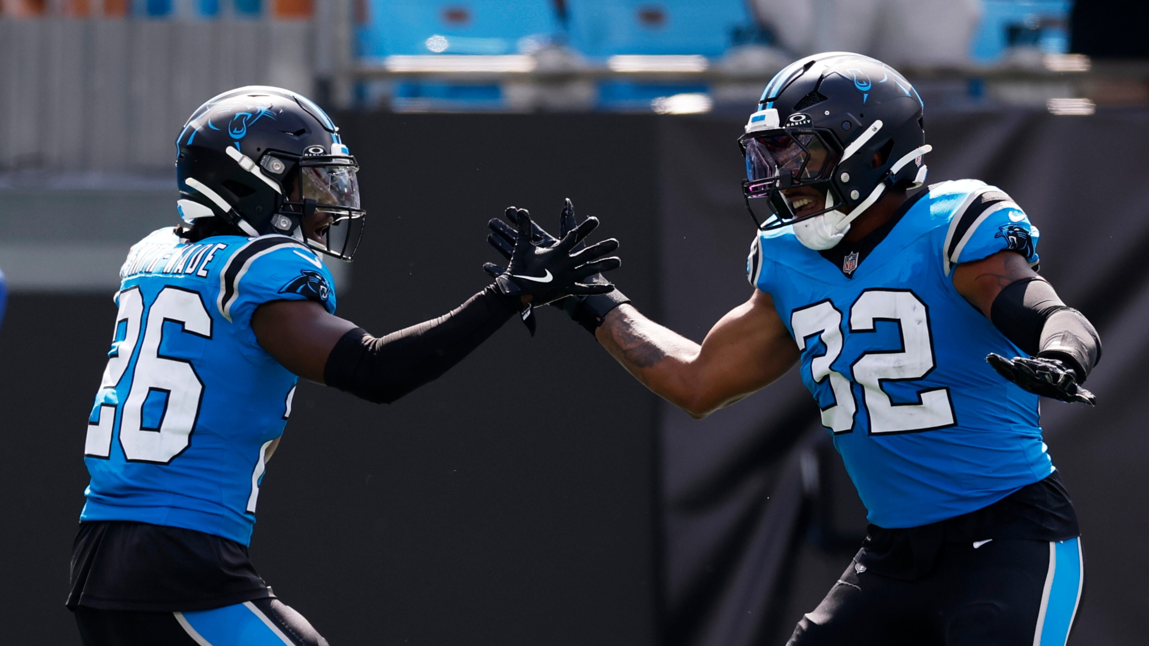 Carolina Panthers cornerback Chau Smith-Wade celebrates after scoring on an interception with linebacker Trevin Wallace against the Atlanta Falcons during the second half of an NFL football game, Sunday, Sept. 21, 2025, in Charlotte, N.C. (AP Photo/Rusty Jones)