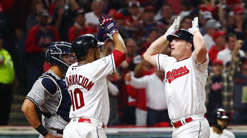 CLEVELAND, OH - OCTOBER 05: Jay Bruce #32 is congratulated by his teammate Edwin Encarnacion #10 of the Cleveland Indians after hitting a two-run home run during the fourth inning against the New York Yankees during game one of the American League Division Series at Progressive Field on October 5, 2017 in Cleveland, Ohio. (Photo by Gregory Shamus/Getty Images)