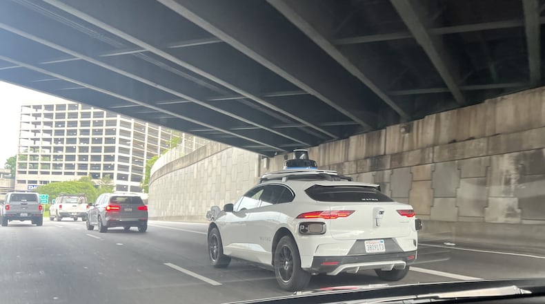 A Waymo vehicle on the Downtown Connector in Atlanta on Wednesday, April 17, 2024.