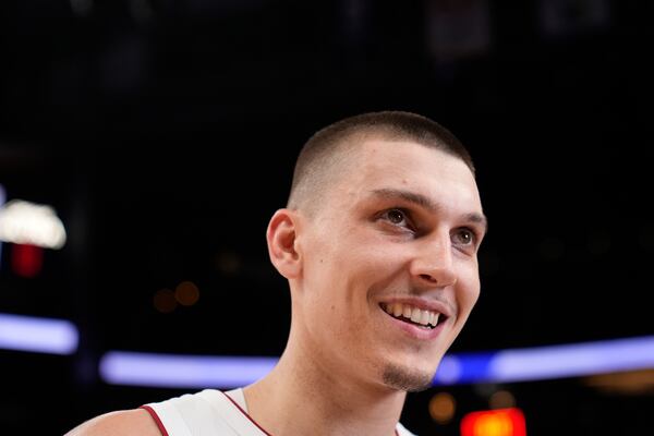 Miami Heat guard Tyler Herro (14) reacts to a win against the Atlanta Hawks after an NBA play-in tournament basketball, Friday, April 18, 2025, in Atlanta. (AP Photo/Brynn Anderson)