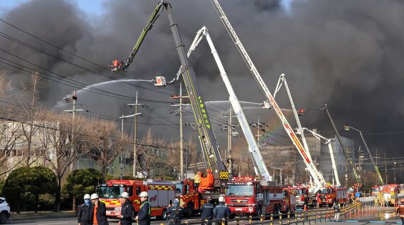 Black smoke rises from an auto parts plant in Daejeon, South Korea, Friday, March 20, 2026. (Kim June-beom/Yonhap via AP)