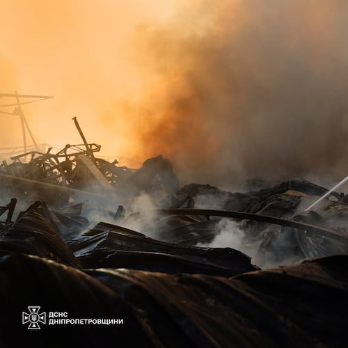 In this photo provided by the Ukrainian Emergency Service, a firefighter puts out a fire following a Russian missile attack in Dnipropetrovsk region, Ukraine, Tuesday, Aug. 4, 2026. (Ukrainian Emergency Service via AP)