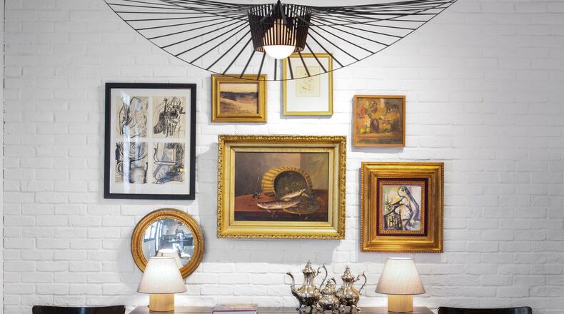 Hayes helped the owners of this historic Castleberry Hill loft with new furnishings and a fresh design. She mixed the couple’s art collection and silver tea service with a contemporary pendant and mid-century dining chairs to create a modern entertaining space. Contributed by Chad Mellon