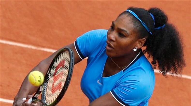 Serena Williams of the U.S. returns in the third round match of the French Open tennis tournament against France's Kristina Mladenovic at the Roland Garros stadium in Paris, France, Saturday, May 28, 2016. (AP Photo/Christophe Ena)