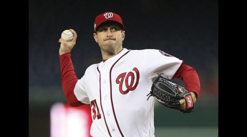 Max Scherzer throws a pitch during his two-hit, 10-strikeout shutout against the Braves on Monday at Nationals Park. (AP photo)