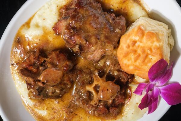 At T's Brunch Bar, find one of its most popular menu items, oxtail and grits. (Courtesy of T's Brunch Bar)