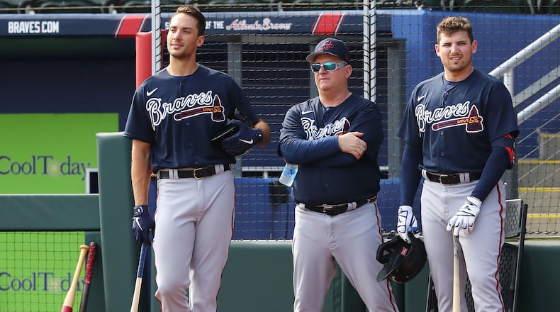Atlanta Braves first baseman Matt Olson (from left), hitting coach Kevin Seitzer, and third baseman Austin Riley watch pitcher Dylan Lee throw live batting practice during Spring Training at CoolToday Park on Wednesday, March 16, 2022, in North Port. Curtis Compton / AJC file