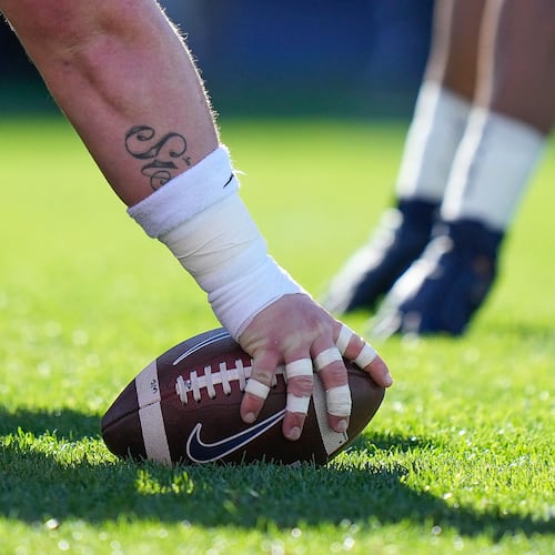Players line up at the line of scrimmage during the first half of an NCAA college football game in East Hartford, Conn., Saturday, Nov. 12, 2022. (AP Photo /Bryan Woolston, File)