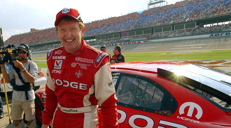 Bill Elliott is all grins after his qualifying run Sept. 26, 2003, at the Talladega Superspeedway in Talladega, Ala.