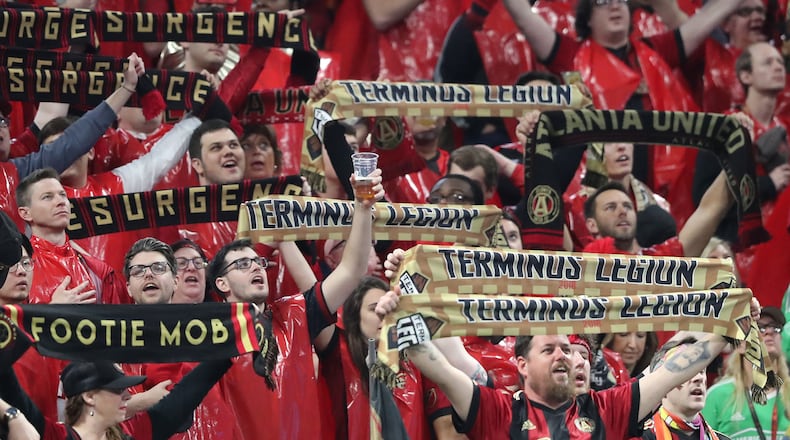 A Atlanta United fan toasts the team as they take on the D.C. United during their home opener in a MLS soccer game on Sunday, March 11, 2018, in Atlanta. Curtis Compton/ccompton@ajc.com