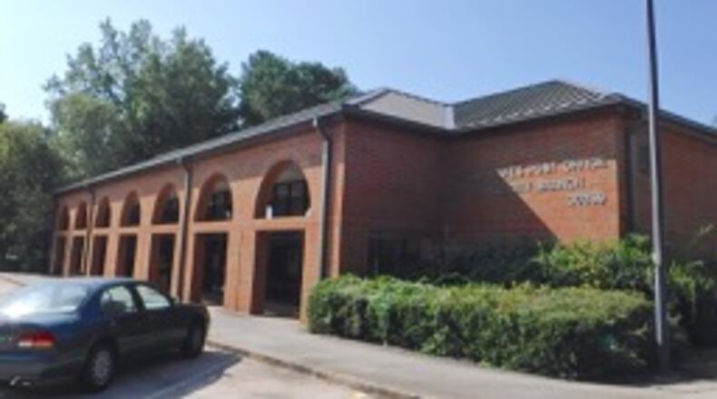 Peachtree City officials and U.S. Rep. Drew Ferguson met with post office representatives to resolve customer complaints. AJC file photo