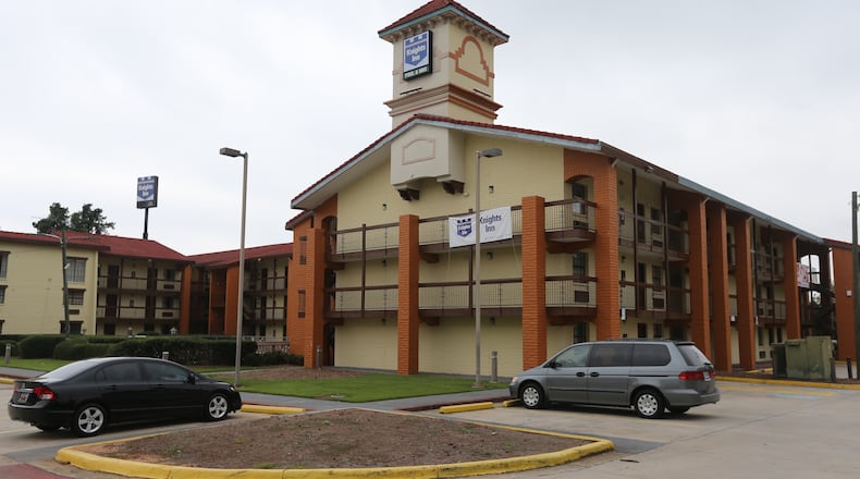 A man and a woman were found shot to death in a room at the Knights Inn in DeKalb County Monday afternoon, and police are still investigating who they are and why they might have been killed. BEN GRAY / BGRAY@AJC.COM