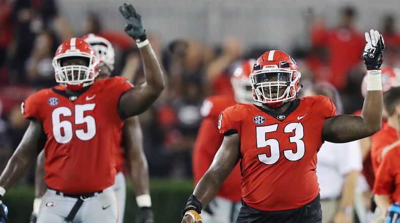 Georgia offensive lineman Kendall Baker and center Lamont Gaillard head into the fourth quarter against Missouri on Saturday, October 14, 2017, in Athens. Curtis Compton/ccompton@ajc.com