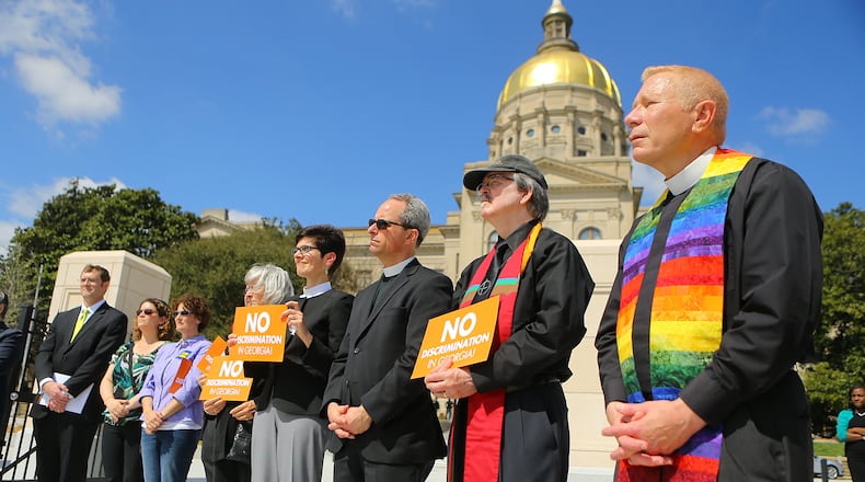 031715 ATLANTA: Members of the clergy participate in a rally at the Capitol against SB 129, the "license to discriminate" legislation pushed by Sen. Josh McKoon and Rep. Sam Teasley on Tuesday, March 17, 2015, at Liberty Plaza in Atlanta. Curtis Compton / ccompton@ajc.com Members of the clergy participate in a Tuesday rally at the state Capitol against S.B. 129, the “religious liberty" legislation pushed by state Sen. Josh McKoon, R-Columbus. Curtis Compton/ccompton@ajc.com