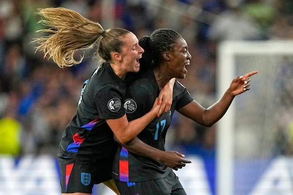 England's Michelle Agyemang, right, celebrates with Ella Toone after scoring her side's first goal during the Women's Euro 2025 semifinals soccer match between England and Italy at Stade de Geneve in Geneva, Switzerland, Tuesday, July 22, 2025. (AP Photo/Martin Meissner)