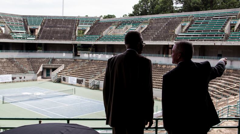 Gwinnett County Administrator Glenn Stephens, right, and Gwinnett Corrections Warden Darrell Johnson speak Tuesday before a press conference and "ceremonial demolition" at the Stone Mountain Tennis Center. Chad Rhym / Chad.Rhym@ajc.com