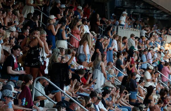 Fans at Truist Park dance and cheer to the music at Braves Country Fest on Saturday, June 13, 2026. (Akili-Casundria Ramsess for the AJC)