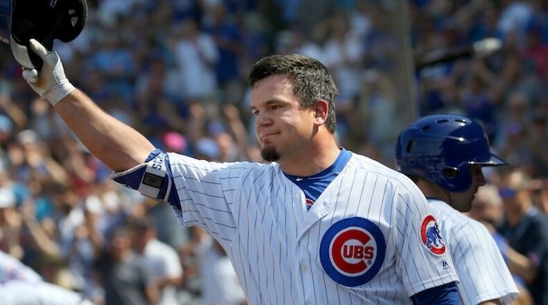 Chicago Cubs' Kyle Schwarber comes out of the dugout to tip his hat after hitting a home run in the sixth inning against the Colorado Rockies at Wrigley Field Sunday, June 11, 2017 in Chicago. (Nancy Stone/Chicago Tribune/TNS)