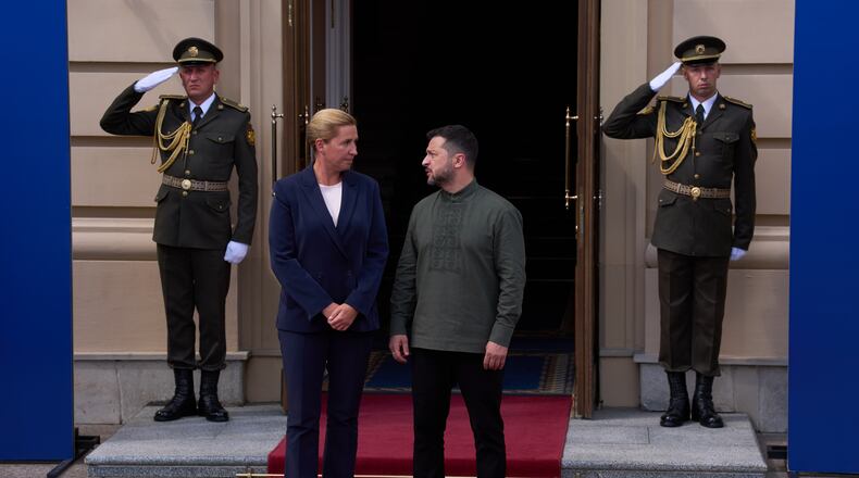 Danish Prime Minister Mette Frederiksen, left, is welcomed by President Volodymyr Zelenskyy during a Ukrainian and Nordic-Baltic countries summit in Kyiv, Sunday, Aug. 23, 2026. (AP Photo/Francisco Seco)
