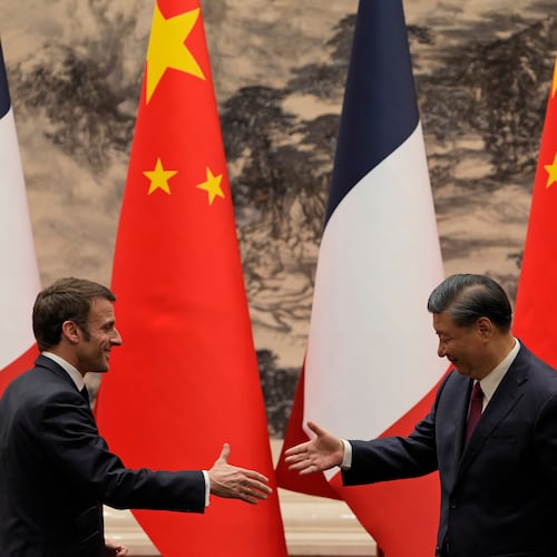 FILE - French President Emmanuel Macron, left, shakes hands with Chinese President Xi Jinping after meeting the press at the Great Hall of the People in Beijing on April 6, 2023. (AP Photo/Ng Han Guan, Pool, File)