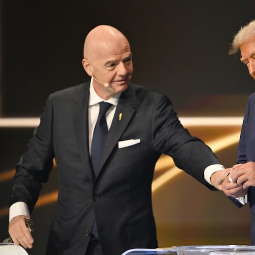 FIFA President Gianni Infantino pauses President Donald Trump during the draw for the 2026 soccer World Cup at the Kennedy Center in Washington, Friday, Dec. 5, 2025. (Mandel Ngan/Pool Photo via AP)
