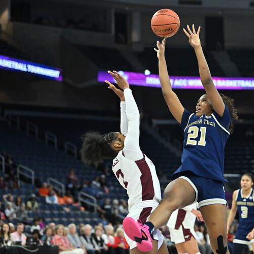 Georgia Tech guard Talayah Walker (21) gets off a shot over Virginia Tech guard Leila Wells (2) during the second half in the ACC women's basketball tournament at Gas South Arena, Thursday, March 5, 2026, in Duluth. Virginia Tech defeat Georgia Tech, 62-54. (Hyosub Shin/AJC)
