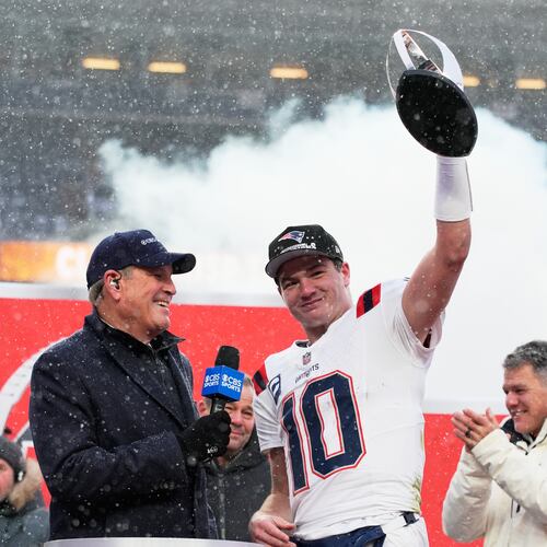 New England Patriots quarterback Drake Maye celebrates with the trophy after the AFC Championship NFL football game between the Denver Broncos and the New England Patriots, Sunday, Jan. 25, 2026, in Denver. (AP Photo/John Locher)