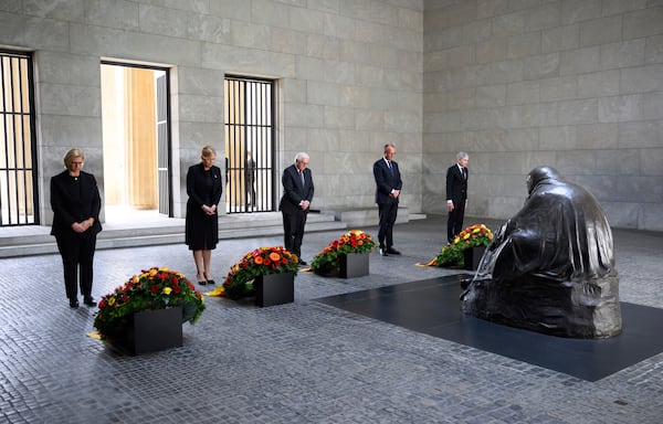 German Federal President Frank-Walter Steinmeier, center, lays a wreath at the Neue Wache, the Federal Republic of Germany's central memorial to the victims of war and tyranny, with representatives of the federal constitutional bodies from left, Anke Rehlinger, Minister-President of Saarland and current President of the Bundesrat, Bundestag President Julia Klöckner, Federal Chancellor Friedrich Merz, and Stephan Harbarth, President of the Federal Constitutional Court, in Berlin, Thursday, May 8, 2025, on the 80th anniversay the Second World War in Europe came to an end. (Bernd von Jutrczenka/dpa via AP)