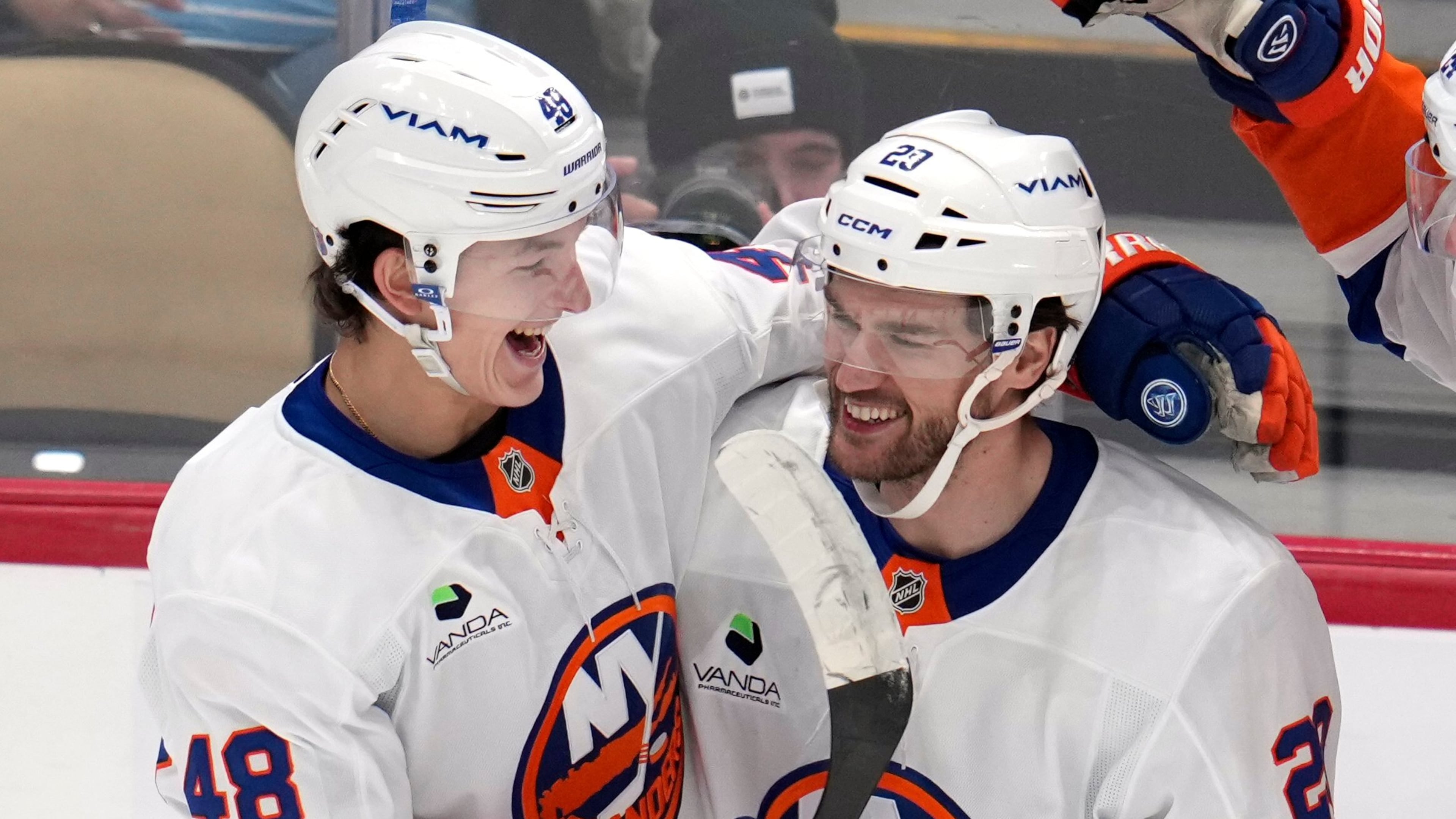 New York Islanders' Jonathan Drouin (29) celebrates after his goal with Matthew Schaefer (48) during the first period of an NHL hockey game against the Pittsburgh Penguins in Pittsburgh, Thursday, Oct. 9, 2025. (AP Photo/Gene J. Puskar)