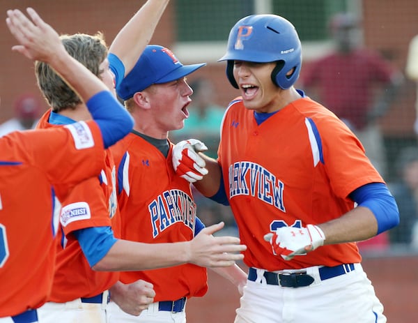 This 2012 file photo shows current Braves first baseman Matt Olson (right) celebrating a homer for Parkview High School — arch nemesis of Chad Bishop's alma mater.
