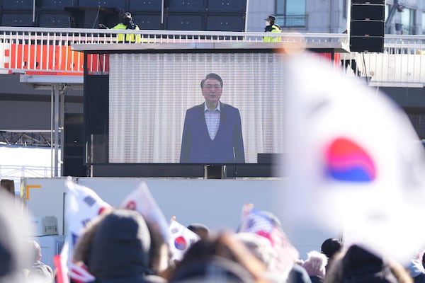 FILE - A huge screen shows a footage of impeached South Korean President Yoon Suk Yeol as supporters stage a rally to oppose his impeachment near the presidential residence in Seoul, South Korea, on Jan. 15, 2025. (AP Photo/Lee Jin-man, File)