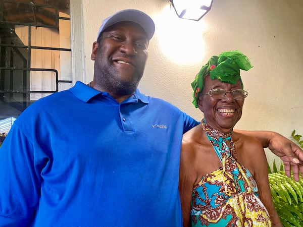 Jason Walker, president of Caribbean Georgia Vote, with his 91-year-old mother, Edna Walker, earlier this yearduring a visit in Kingston, Jamaica. (Courtesy Jason Walker)