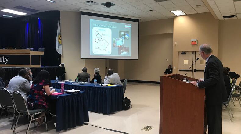Ryan Cira, environmental health director for the DeKalb Board of Health, briefs the Board of Commissioners on mosquito-borne diseases on Sept. 18, 2018. TIA MITCHELL/TIA.MITCHELL@AJC.COM