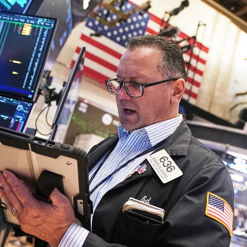 Trader Edward Curran works on the floor of the New York Stock Exchange, Wednesday, April 22, 2026. (AP Photo/Richard Drew)
