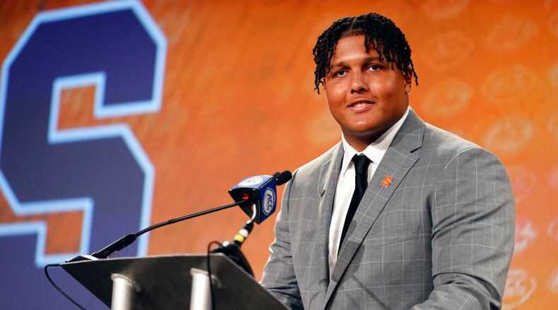 Syracuse offensive lineman Matthew Bergeron answers a question at the NCAA college football ACC media days in Charlotte, N.C., Wednesday, July 20, 2022. (AP Photo/Nell Redmond)