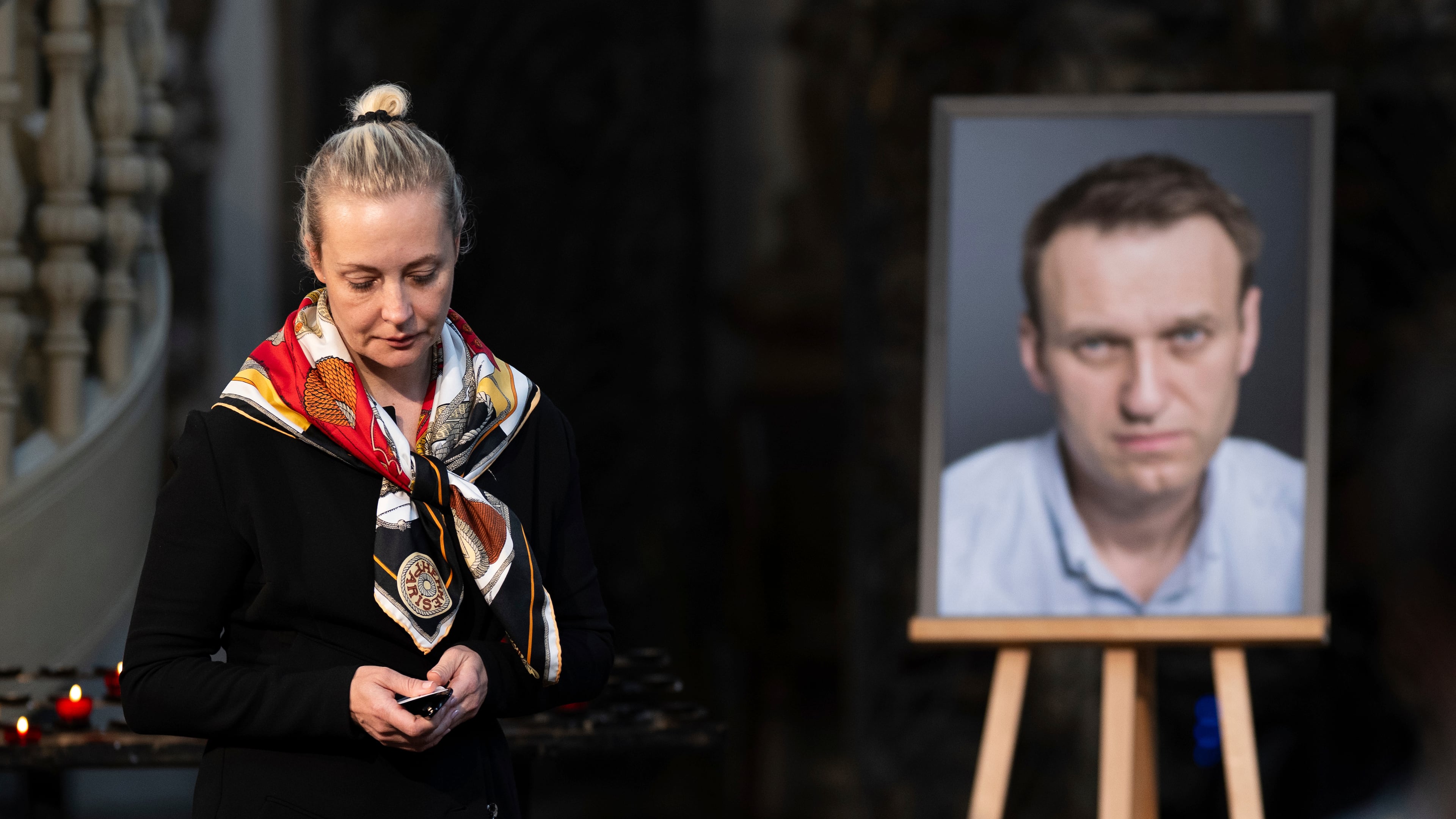 FILE -Yulia Navalnaya, widow of Russian opposition leader Alexei Navalny walks away from his picture after lighting a candle at the end of a service in St. Mary's Church on the occasion of his birthday, in Berlin, June 4, 2024. (Christoph Gollnow/dpa/dpa via AP, File)
