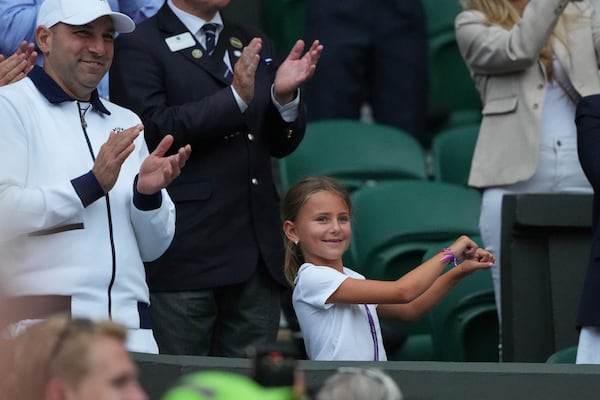 Tara, the daughter of Novak Djokovic of Serbia does a dance as she celebrates her father beating Miomir Kecmanovic of Serbia during a third round men's singles match at the Wimbledon Tennis Championships in London, Saturday, July 5, 2025. (AP Photo/Kirsty Wigglesworth)
