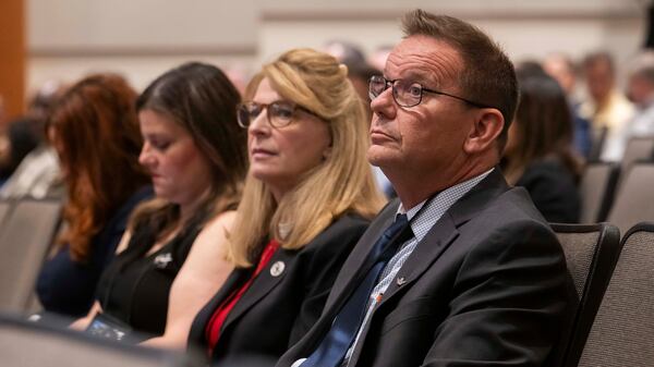 Tim and Sheri Lilley, father and stepmother of Sam Lilley, and Tiffany Gibson, Sam’s sister, attend the first day of the NTSB fact-finding hearing in Washington last July. (Craig Hudson for the AJC 2025)