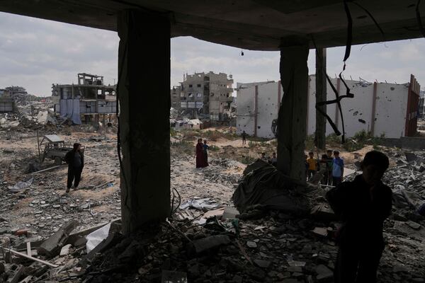 Palestinians look at the damage after an Israeli army airstrike in Beit Lahia, northern Gaza Strip, Monday, April 28, 2025. (AP Photo/Jehad Alshrafi)