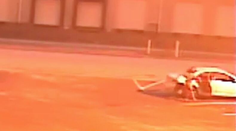 A witness said the man forced the woman into the back seat of a light-colored sedan and drove away. (Fox13Memphis.com)