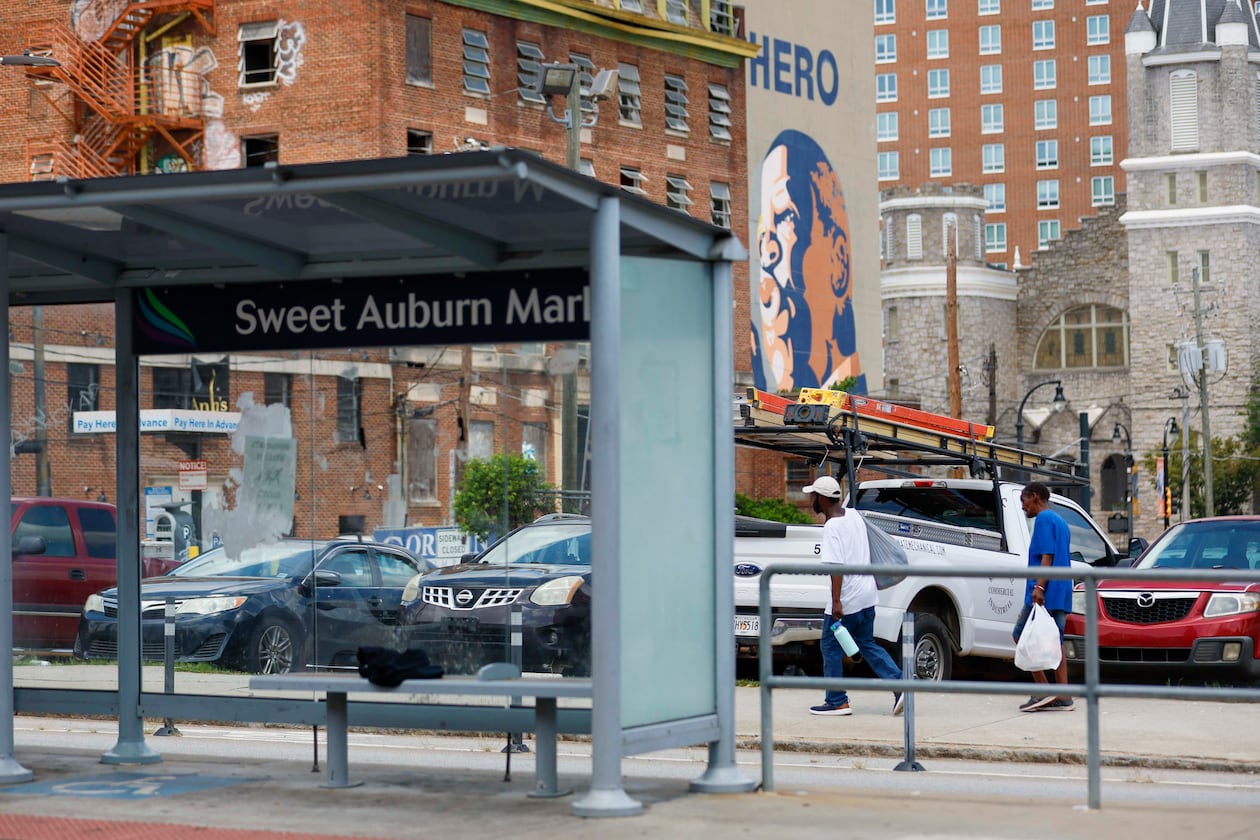 Pedestrians walk along Edgewood Avenue in Atlanta on Wednesday, July 30, 2025, just two days after one person was killed and 10 others were injured in an area shooting. A third suspect was arrested Wednesday in the case. (Miguel Martinez/AJC)